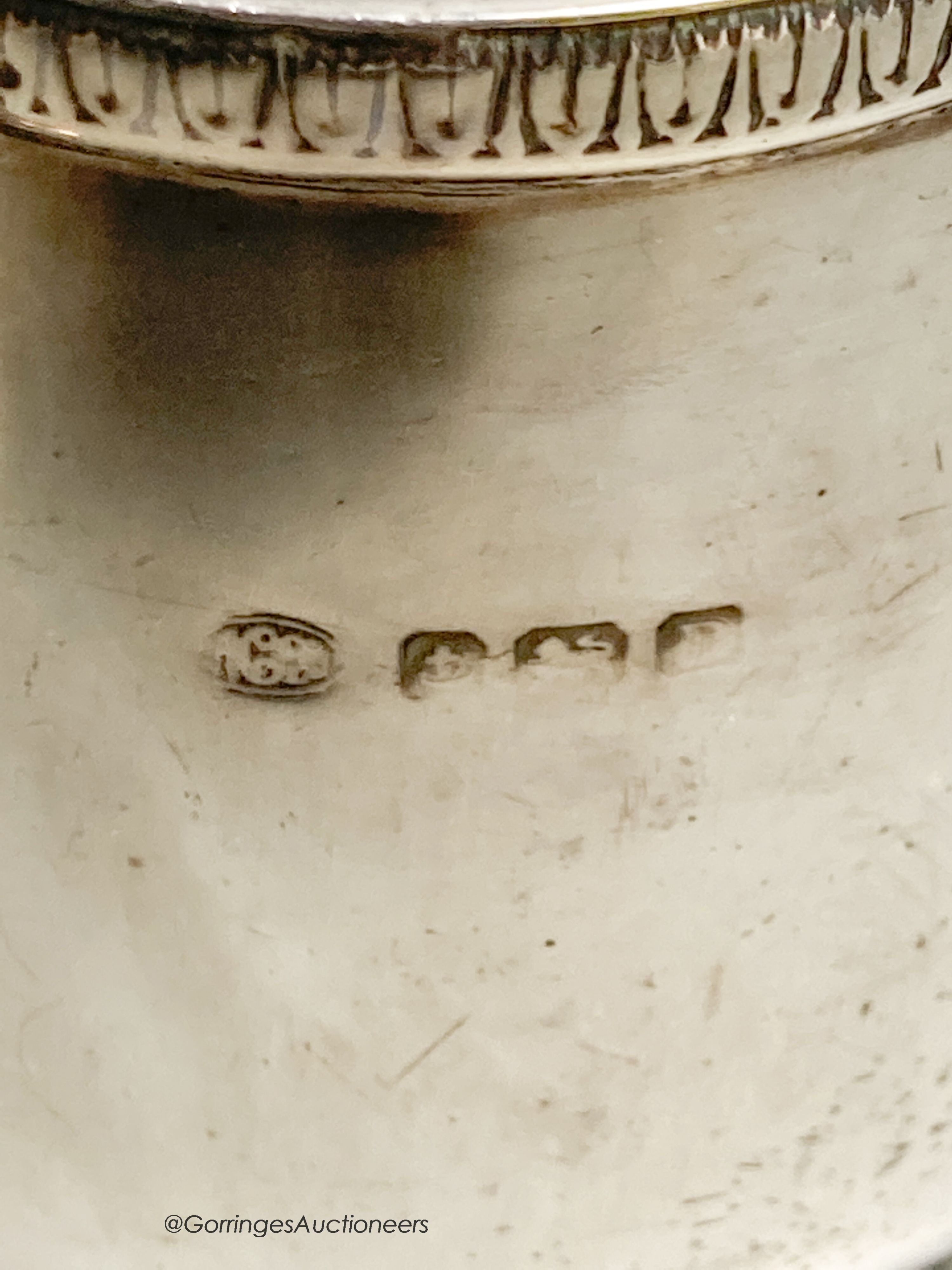 A George V silver jug, Birmingham, 1928, a silver caster and two silver napkin rings, 10oz.